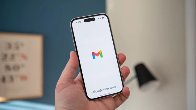 Hand holding Gmail smartphone