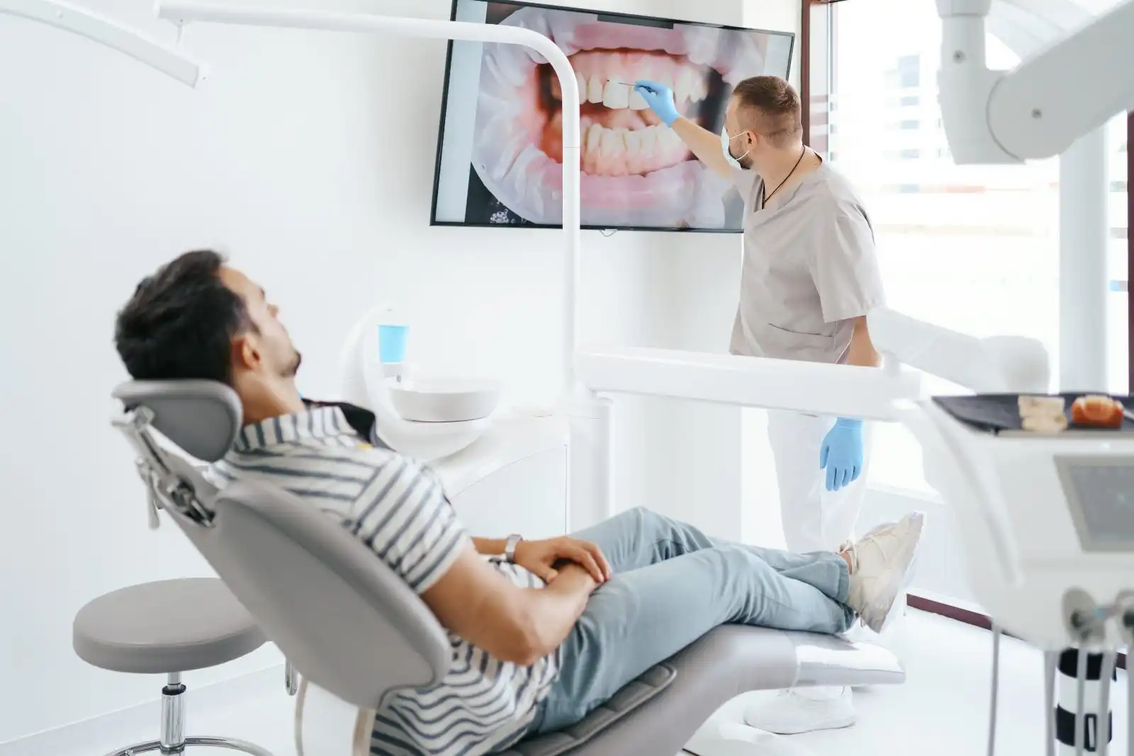 Dentist treating a patient in a dental chair