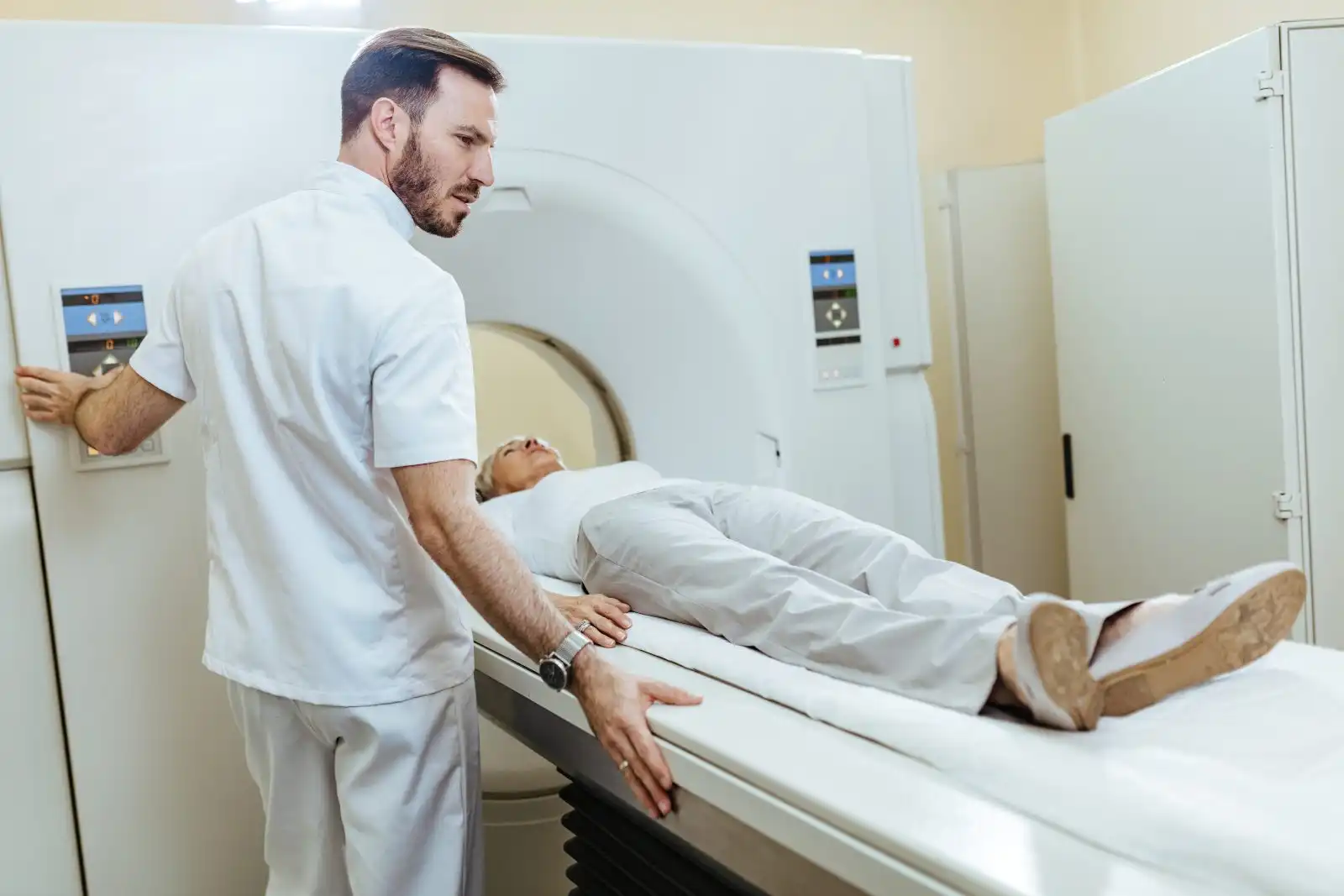 Technician beside a diagnostic scanner