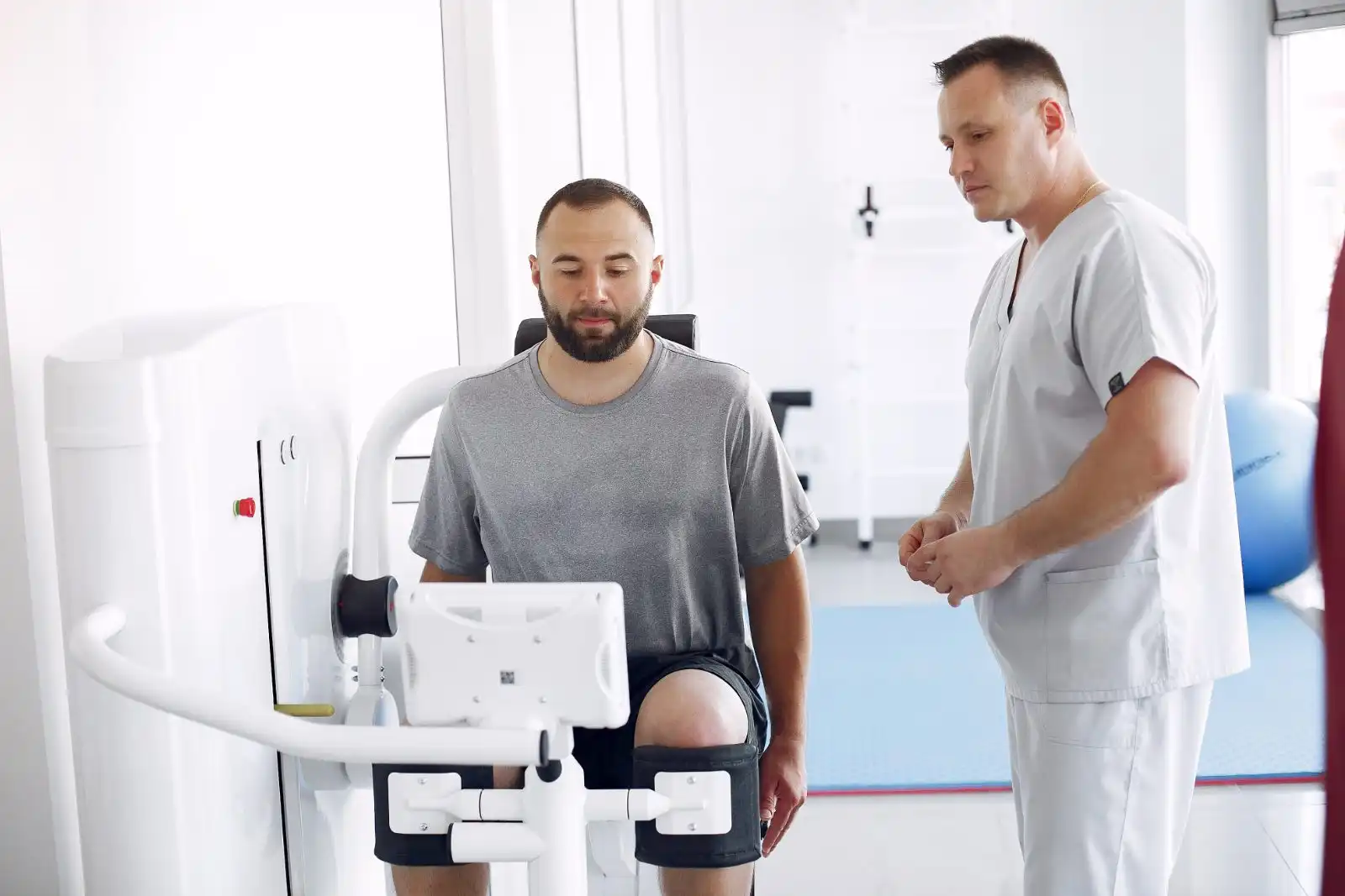 Physiotherapist guiding a rehab exercise